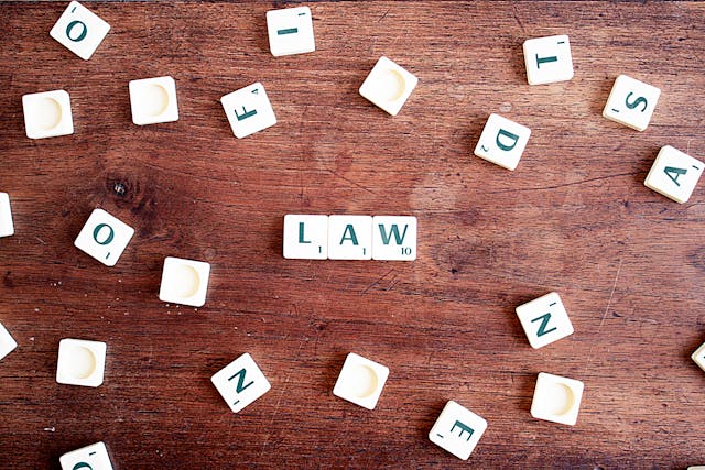 the word law spelled on letter tiles